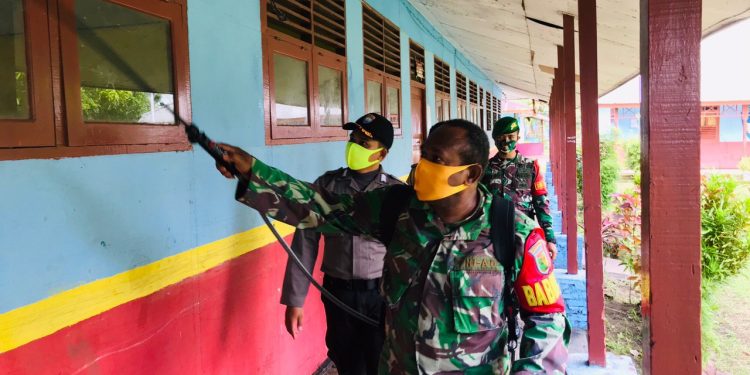 Satgas Yonif 125/SMB Gandeng Babinsa, Babinkamtibmas dan Kepala Kampung Cegah Covid-19