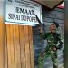 Begini Reaksi Kodam Cenderawasih Usai Beredar Foto Prajurit TNI Pegang Senjata di Depan Gereja di Papua